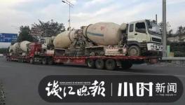 巨無霸來了！半掛車“背”著水泥車欲上高速！